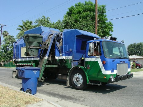 Waste collection trucks operating in Harrow